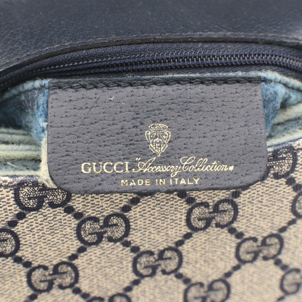 ■ Vintage Gucci shoulder bag with GG Supreme horsebit detail and gold hardware. Women's dark navy.