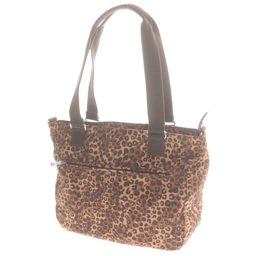 Kipling hand tote bag with zipper closure, leopard print, heart pattern, multicolor, light brown, and black.