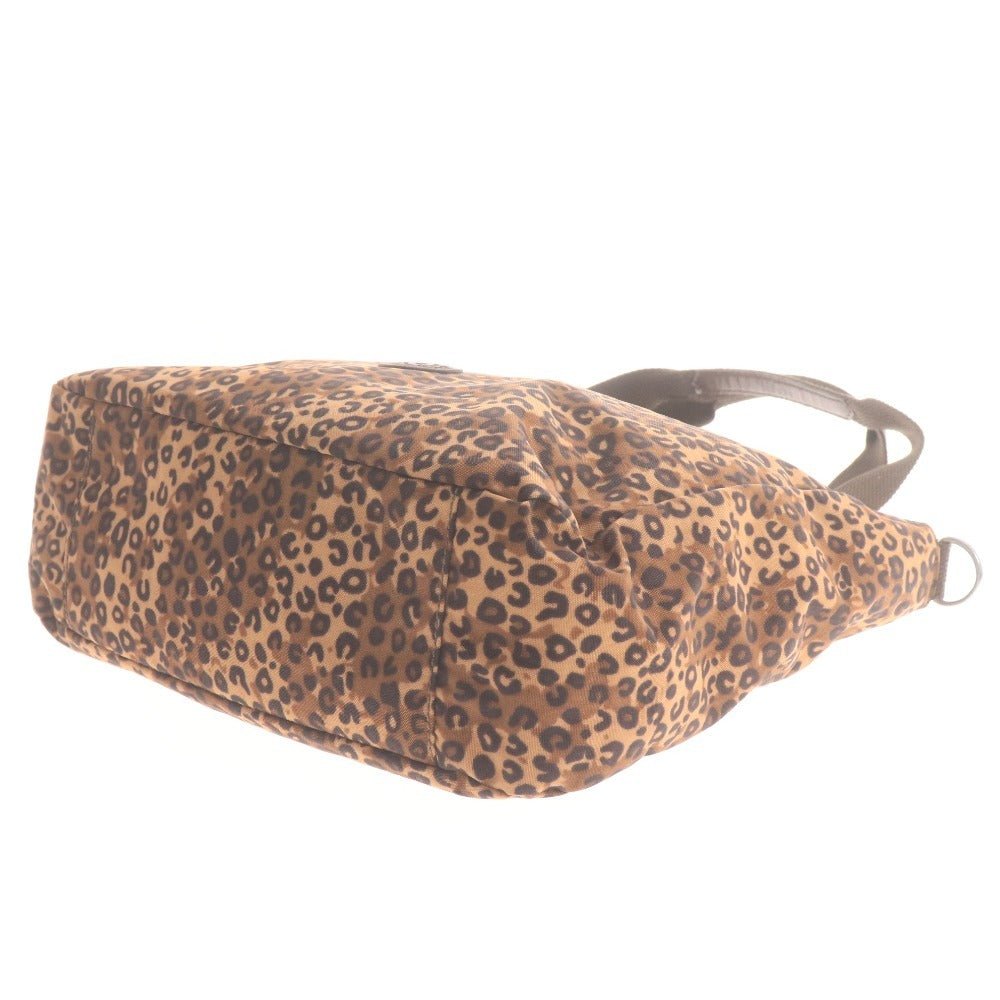 Kipling hand tote bag with zipper closure, leopard print, heart pattern, multicolor, light brown, and black.