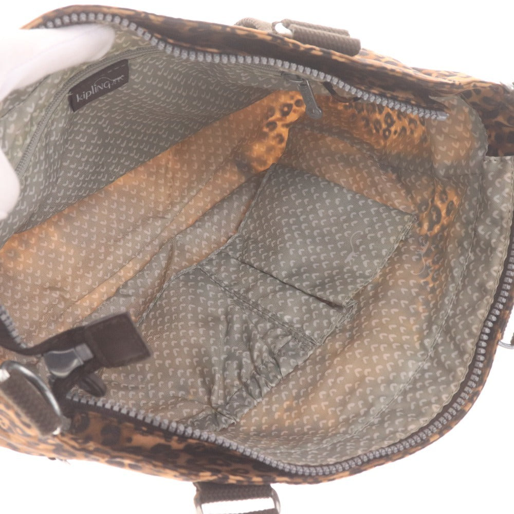 Kipling hand tote bag with zipper closure, leopard print, heart pattern, multicolor, light brown, and black.