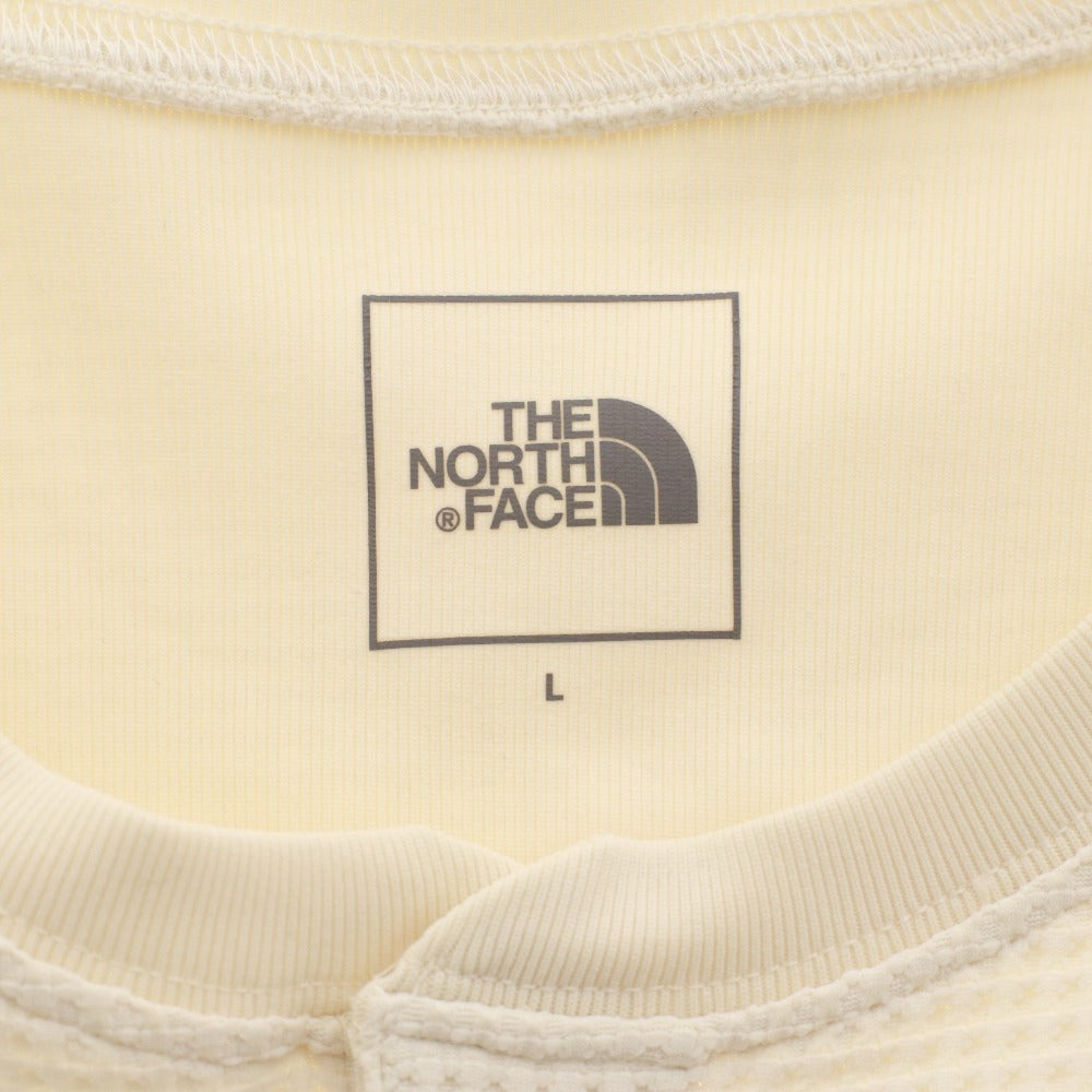 The North Face T-shirt NT62374, long sleeves, button closure, crew neck, solid color, one-point detail, men's/women's, size L, ivory, unused