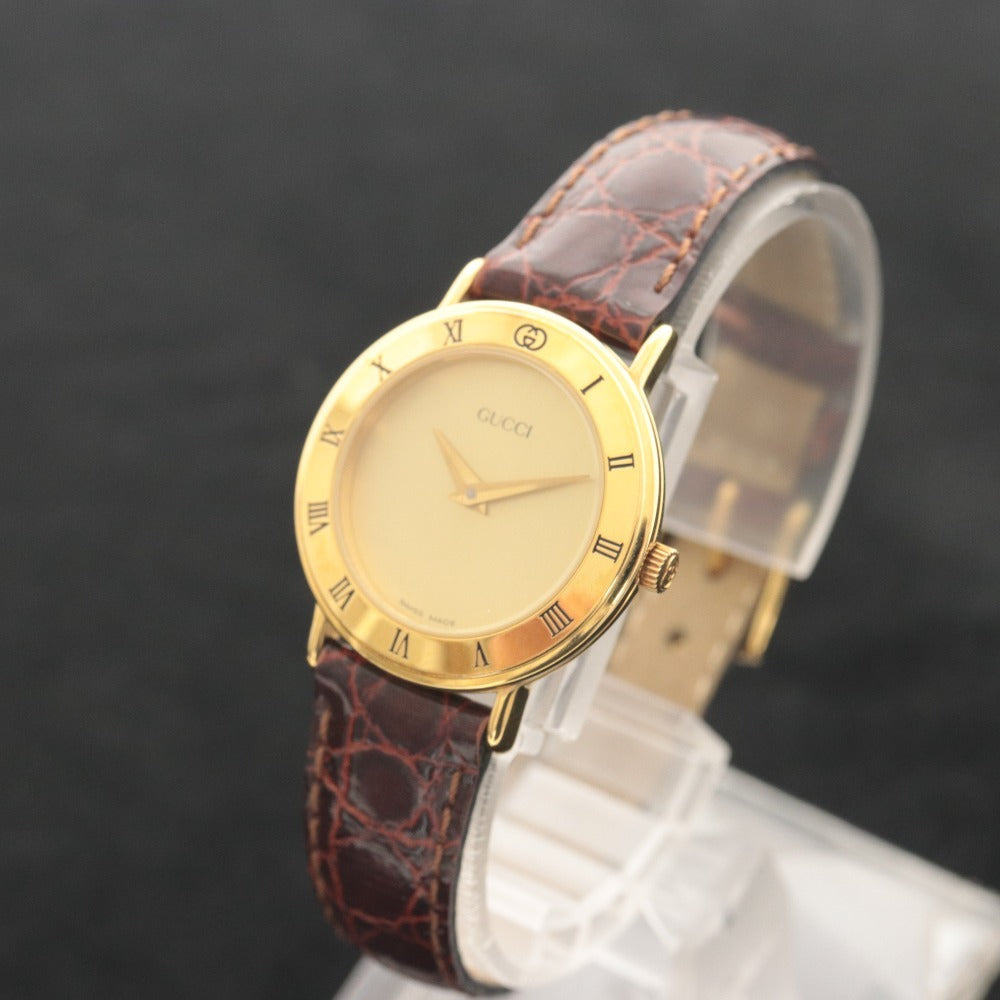 ■ GUCCI グッチ 腕時計 3000.2.L クォーツ 17.9g レディース ゴールド ベルト 赤茶系
