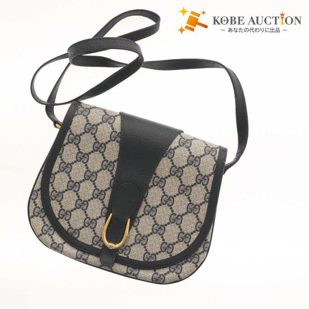 ■ Vintage Gucci shoulder bag with GG Supreme horsebit detail and gold hardware. Women's dark navy.