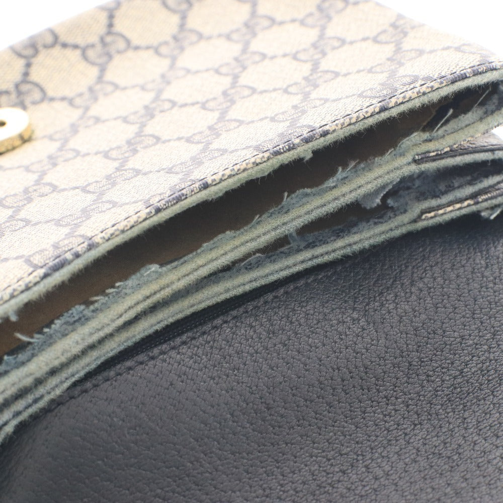 ■ Vintage Gucci shoulder bag with GG Supreme horsebit detail and gold hardware. Women's dark navy.