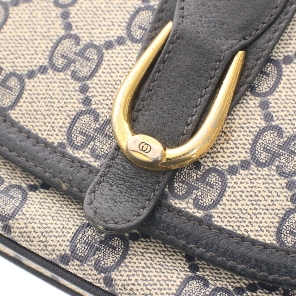 ■ Vintage Gucci shoulder bag with GG Supreme horsebit detail and gold hardware. Women's dark navy.