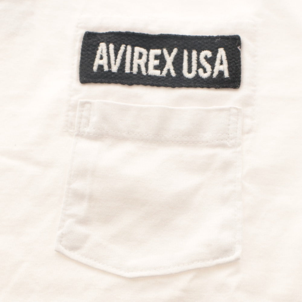 ■ AVIREX Tシャツ ファティーグ クルーネック 半袖 トップス USA WOMAN ロゴ 胸ポケット レディース S 白 タグ,ボタン付き 未使用(汚有)