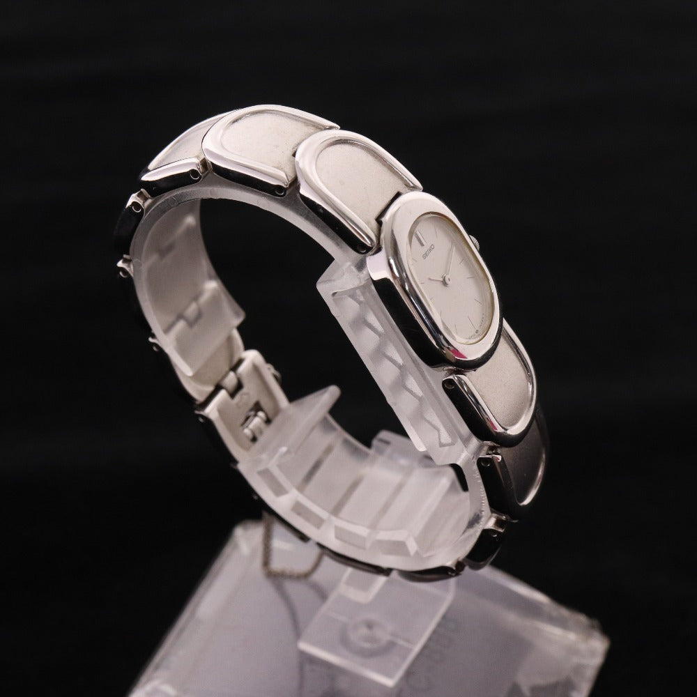 ■ セイコー 腕時計1E20-5440 オーバル クォーツ 51.1g レディース シルバー 文字盤 ホワイト 付属品付き ジャンク