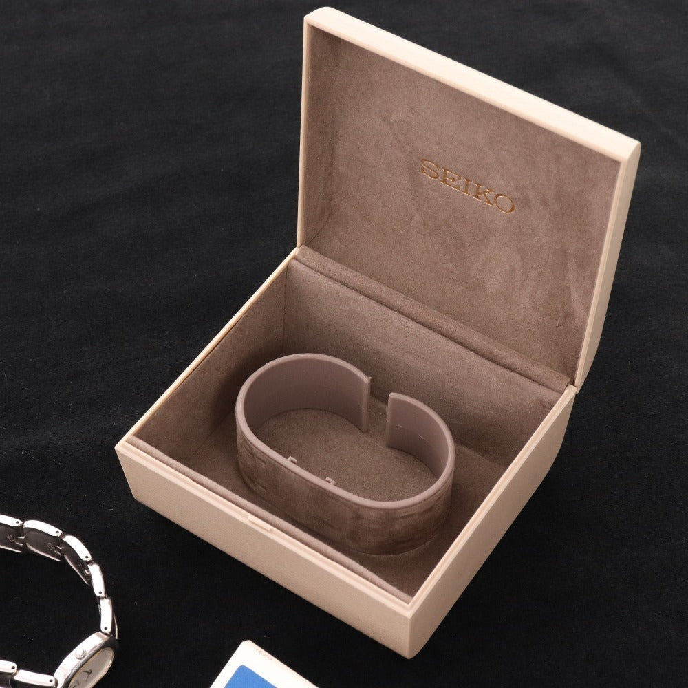 ■ セイコー 腕時計1E20-5440 オーバル クォーツ 51.1g レディース シルバー 文字盤 ホワイト 付属品付き ジャンク