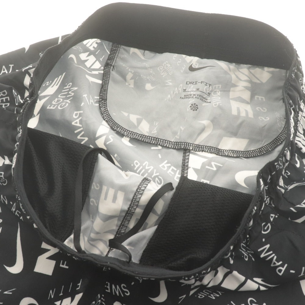■ ナイキ ランニングパンツ ボトムス ドライフィット チャレンジャー 7インチ ショーツ AOP Dri-FIT ロゴ柄 トレーニング メンズ M 白黒